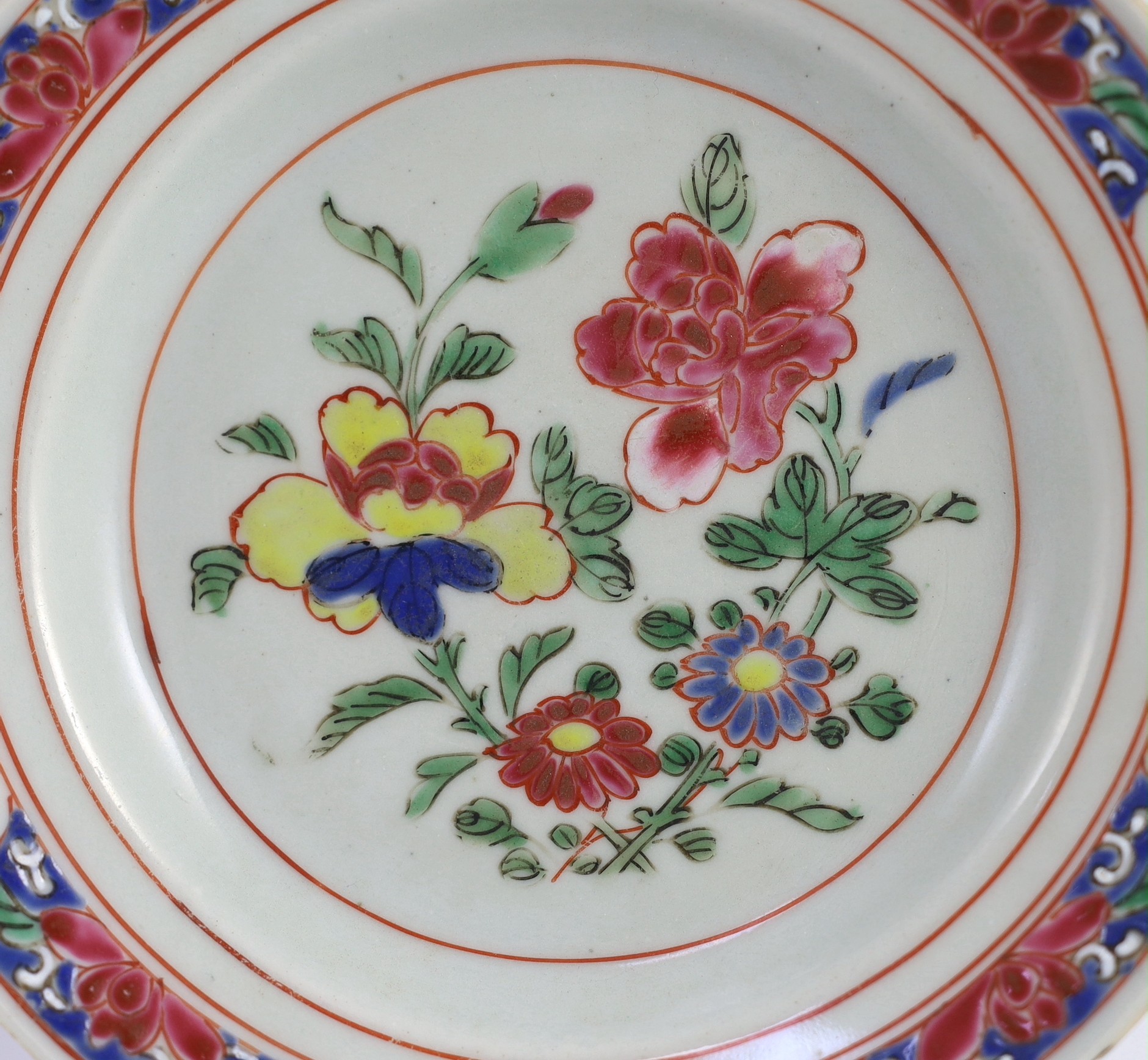 A pair of Chinese famille rose fencai small plates, early Yongzheng period, 16 cms diameter, 16cm diameter